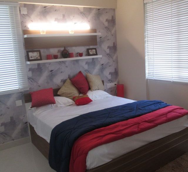 interior design of the bedroom for luxury apartments in kakkanad